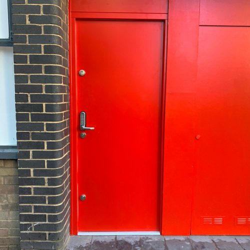 Red steel doors and internal window shutter